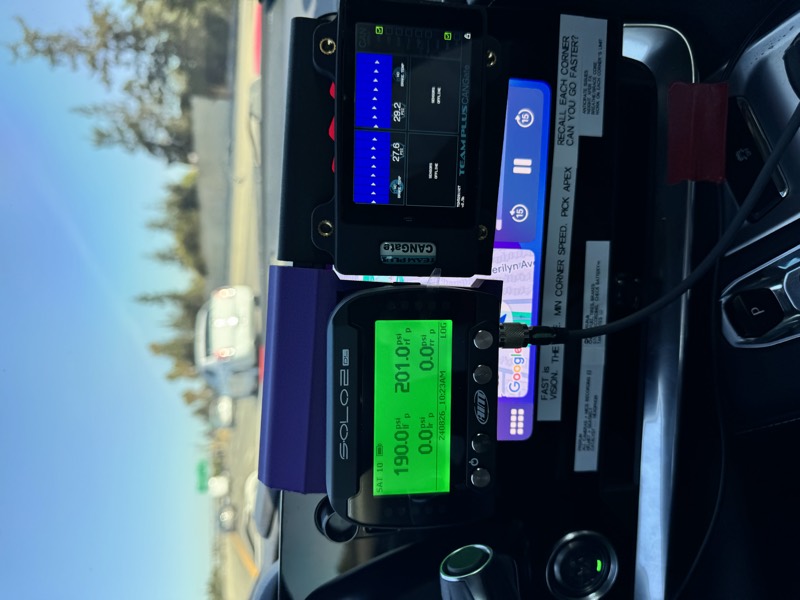 AIM Solo2 DL in its dash mount next to the CANgate